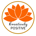 Image is the Creatively Positive wordmark logo, found inside the golden brown circle which has a peaceful, serene simple image of the lotus flower, transparent background