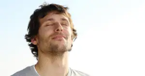 Young Man Practicing Deep Breathing